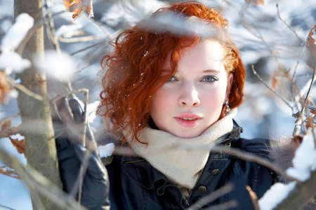 winter portrait of a beautiful woman freezingの写真素材