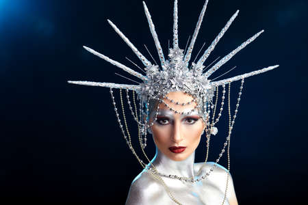 close up fashion portrait of a woman with body paint looking like a Statue of Libertyの写真素材
