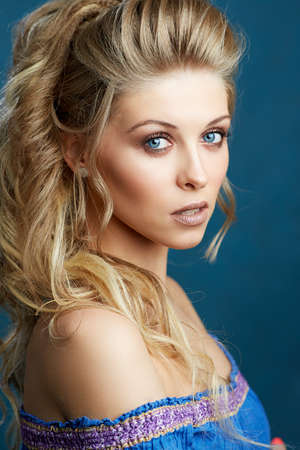 Close-up portrait of a caucasian young woman with beautiful blue eyesの写真素材