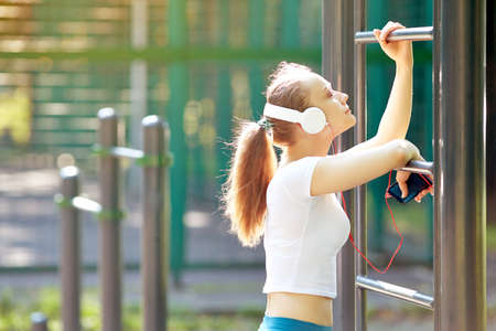 Fitness woman resting after intense physical trainingの写真素材