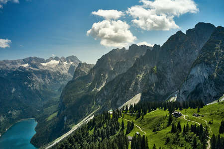 areal shot landscape from above in sunrise. lake mountains cloudsの写真素材