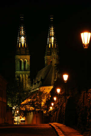 Cathedral of Peter and Paul in Prague in the night with a road decorated by shining lanterns. Looks nostalgic and full of atmosphereの写真素材