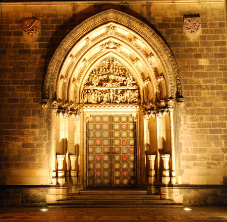 Illuminated portal of a czech cathedral on Vysehrad in the nightの写真素材