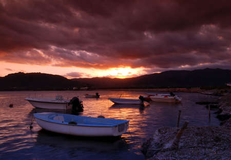 Beautiful sunset over harbor with dramatic skyの写真素材