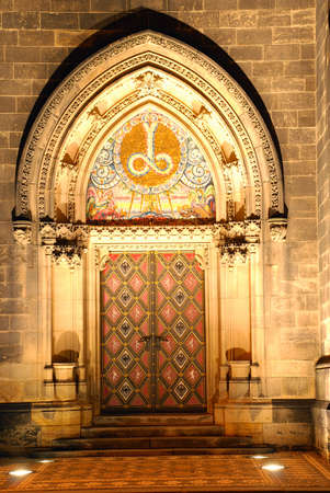 Illuminated portal of a czech cathedral on Vysehrad in the nightの写真素材