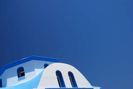 Roof of a Greek church against the blue sky の写真素材