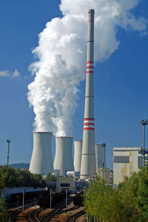 Power plant with supply coal wagons and clouds of white vapourのeditorial素材