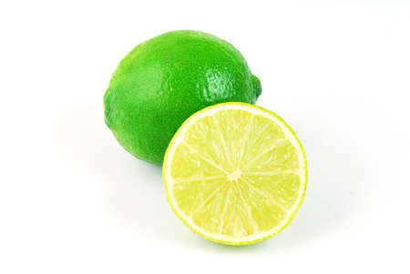 Fresh green lime full of vitamines isolated on light backgroundの写真素材