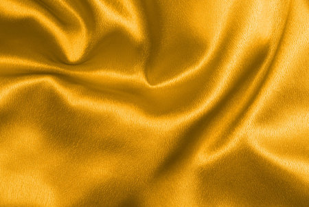 Beautiful and shiny golden satin background - for luxury designsの写真素材