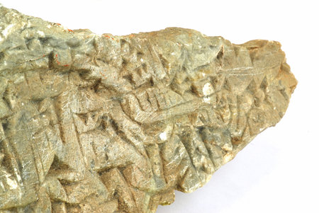 Ancient Sumerian writing carved in the stone isolated