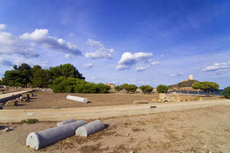 Ancient Sardinian ruins of Nora with sea and lighthouseの写真素材
