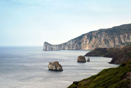 Rocky islands in the Sardinia sea near Porto Flaviaの写真素材