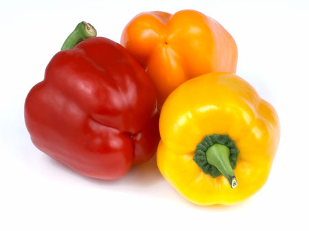 Three beautiful, fresh, colorful and healthy peppers isolated