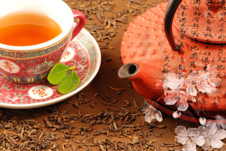 Special Chinese tea ceremony with kettle, calligraphy and cherry bloomの写真素材