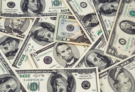 Banknotes of United States of America - dollars - ona one heap. There are all included - 100, 50,...