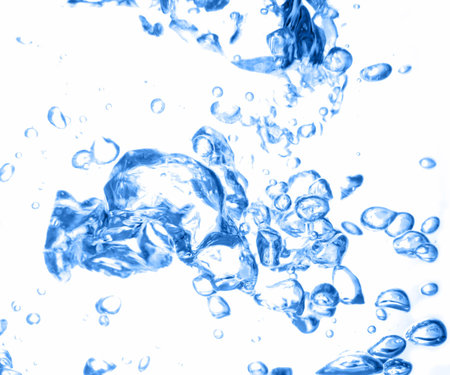 Blue air bubbles in fresh water on white background