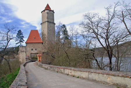 Medieval castle Zvikov in the Czech Republic with round tower, draw-bridge and blue sky wth cloudsの写真素材