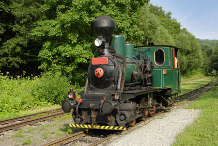 Ancient steam locomotive on a vintage railroad