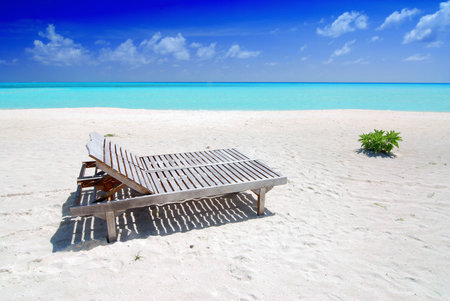 Two canvas chairs on a beautiful Maldivian beach