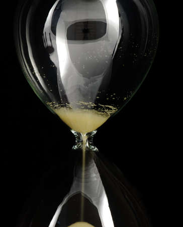 Hourglass detail  isolated on a black background
