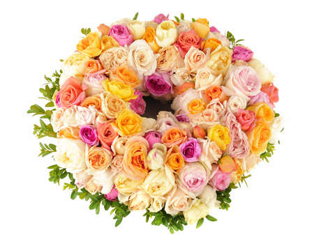 Beautiful ornamental wreath of multicolored roses isolated on whiteの写真素材