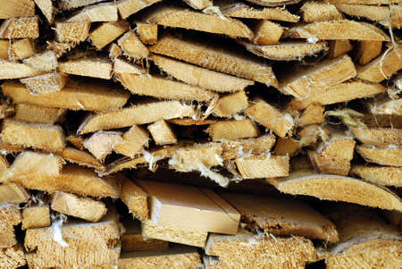 Pile of wooden logs and sticks for ecological heatingの写真素材