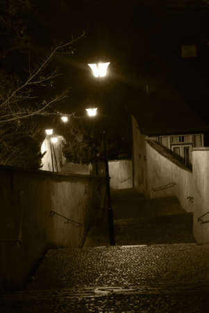 Old castle stairs from Prague castle to Little Quarter in sepiaの写真素材