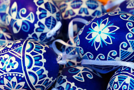 Various Easter eggs on a one heap with ribbonの写真素材