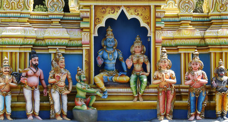 Detail of a beautiful vivid hindu temple with statues of deity