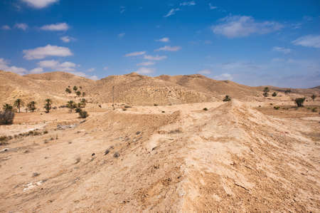 Not only sand dunes, but also arid mountains are a face of mighty desert Saharaの写真素材