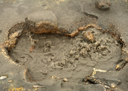 Mudpot in the geothermal area Kerlingarfjoll, Iceland. The area around the boiling mud is...