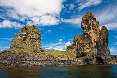 Two major basalt formations at Londrangar allow framing glacier Snaefellsjokull between the columns. Snaefellsness peninsula, Icelnadの写真素材
