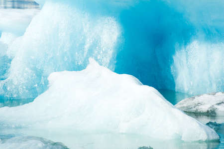 Detailed photo of the Icelandic glacier iceberg in a ice lagoon with incredibly vivid colors and a nice textureの写真素材