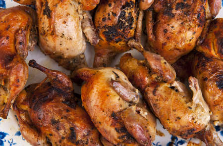 Big plate full of freshly roasted quails の写真素材