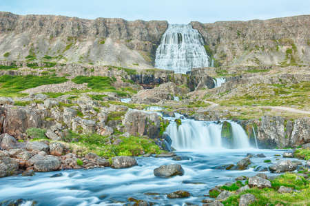 Dynjandi is the most famous waterfall of the West Fjords and one of the most beautiful waterfalls in the whole Iceland. It is actually the cascade of waterfalls of which the one on the photo is the largest one. の写真素材