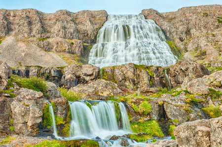 Dynjandi is the most famous waterfall of the West Fjords and one of the most beautiful waterfalls in the whole Iceland. It is actually the cascade of waterfalls of which the one on the photo is the largest one. の写真素材