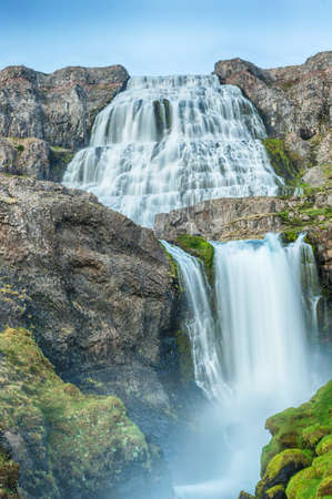 Dynjandi is the most famous waterfall of the West Fjords and one of the most beautiful waterfalls in the whole Iceland. It is actually the cascade of waterfalls of which the one on the photo is the largest one. の写真素材