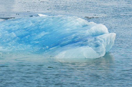 Detailed photo of the Icelandic glacier iceberg in a ice lagoon with incredibly vivid colors and a nice textureの写真素材