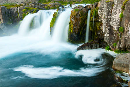 Dynjandi is the most famous waterfall of the West Fjords and one of the most beautiful waterfalls in the whole Iceland  It is actually the cascade of waterfalls  の写真素材