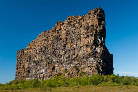 Eyjan rock in Asbyrgi  Asbyrgi is a horseshoe-shaped canyon in the national park Jokulsargljufur in the North of Iceland  The rocky walls of the canyon are up to 100 high and very steep  The canyon was probably formed during great glacial floods の写真素材