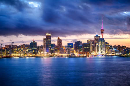 Skyline photo of the biggest city in the New Zealand, Auckland. The photo was taken after sunset across the bayの写真素材