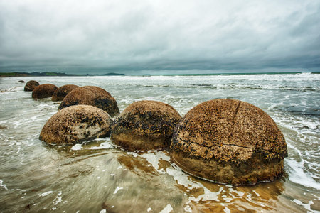 Moeraki Boulders on the Koekohe beach, Eastern coast of New Zealand. HDR imageの写真素材