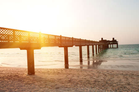 Pier on the Dubai Jumeirah beach at duskの写真素材