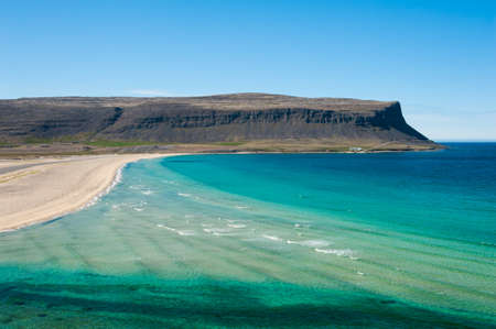 Extremly beautiful bay with mighty golden beaches and turquise sea in the West Fjords, Iceland. Panoramic photoの写真素材