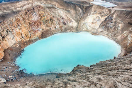 Giant volcano Askja offers a view at two crater lakes. The smaller, turquoise one is called Viti and contains warm geothermal water and is good for swimming. The large lake is Oskjuvatn, the second deepest lake on the Iceland.の写真素材