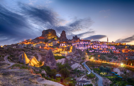 Ancient town and a castle of Uchisar dug from a mountains after twilight, Cappadocia, Turkeyの写真素材