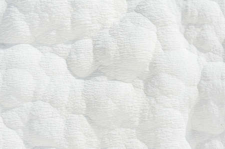 Pamukkale (cotton castle) natural wonder is created by a layers of white travertine looking like cotton, Turkeyの写真素材