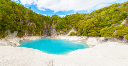Incredibly blue and highly acidic Inferno Crater Lake at Waimangu geothermal area, New Zealandの写真素材