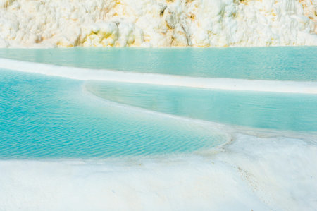 Blue pools and white travertine terraces at Pamukkale, Turkey