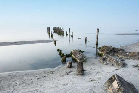 Old broken pier on the coast of the Baltic sea, Latviaの写真素材